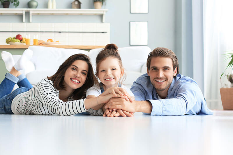 Happy parents and their young daughter