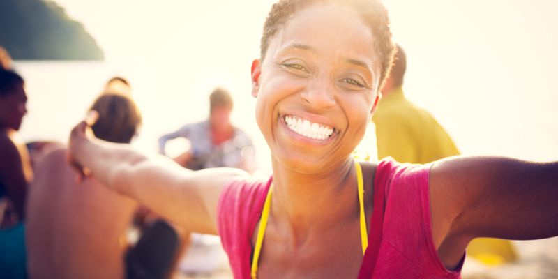 woman smiling with her arms outstretched