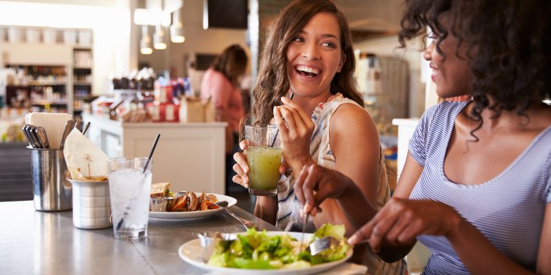 two women eating healthy food